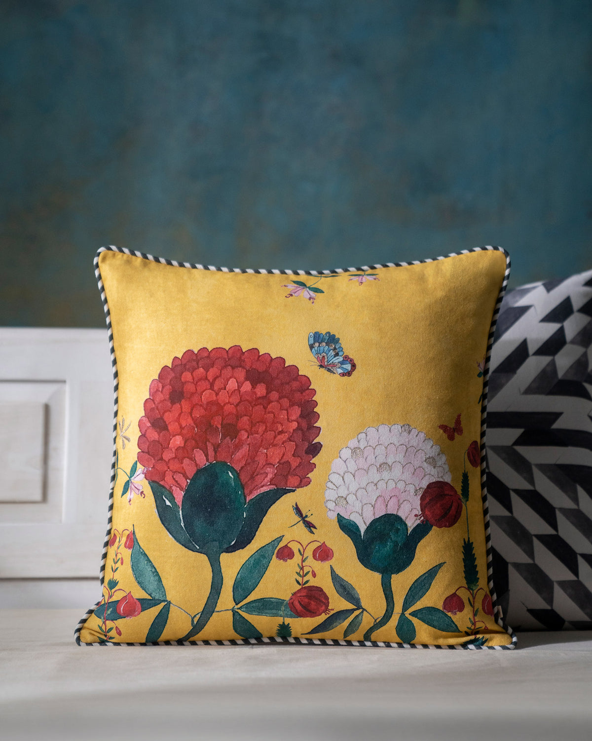 Winter Wonderland Cushion Cover in yellow with red and pink flowers.
