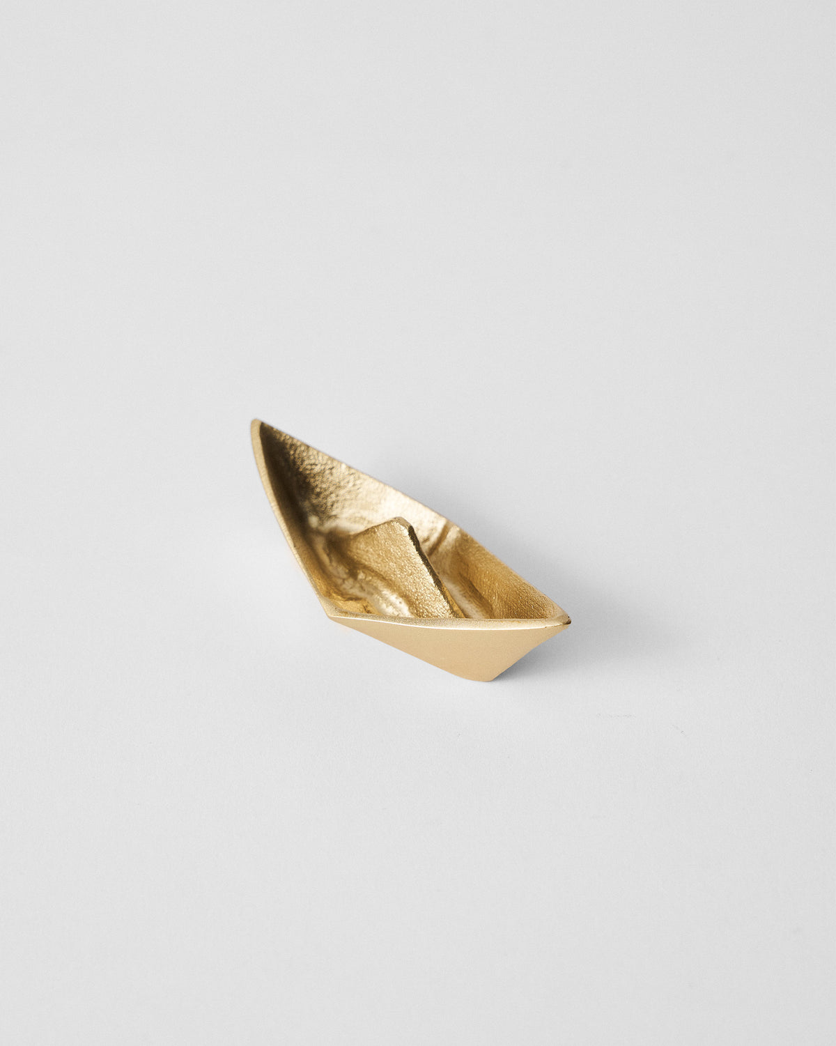 Angled view of the Boat Origami dish showing its inner folds.