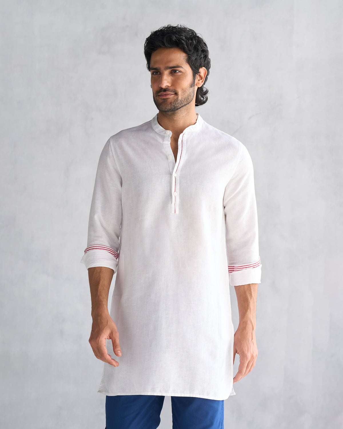 Person wearing a white Chandni Chowk kurta with a Nehru collar.