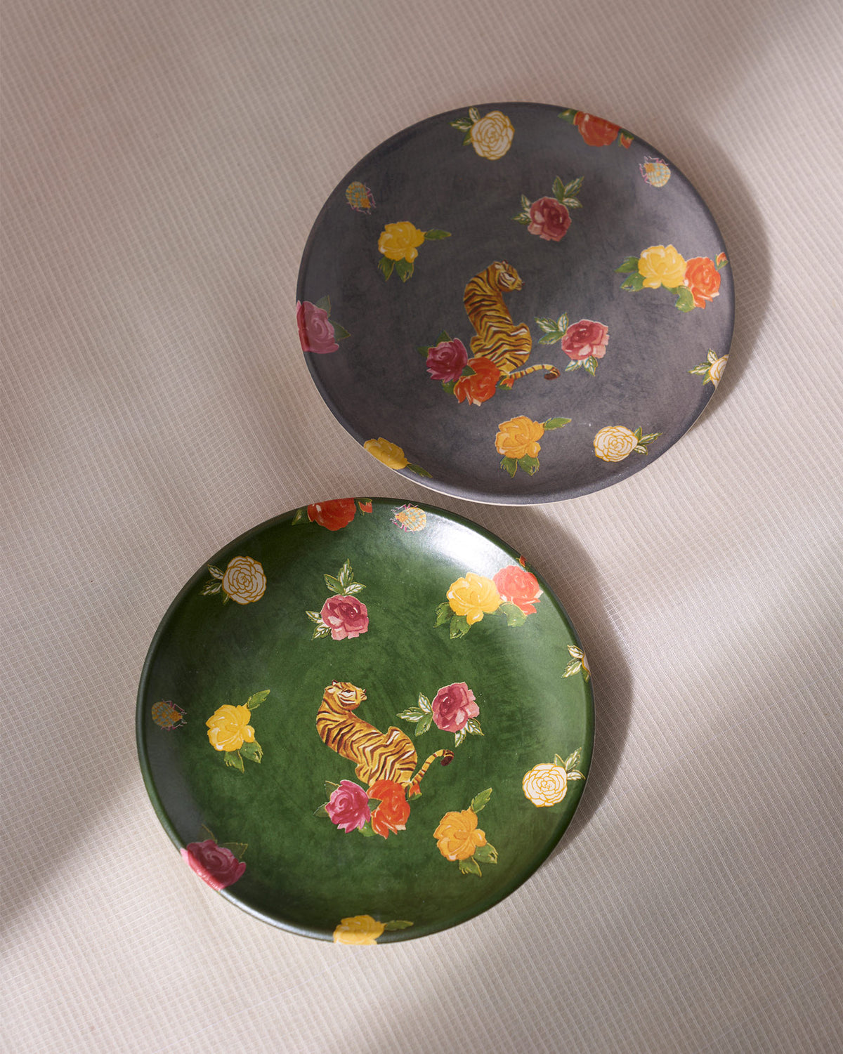 Pair of Tigress Quarter Plates in green and grey with tiger and rose motifs.