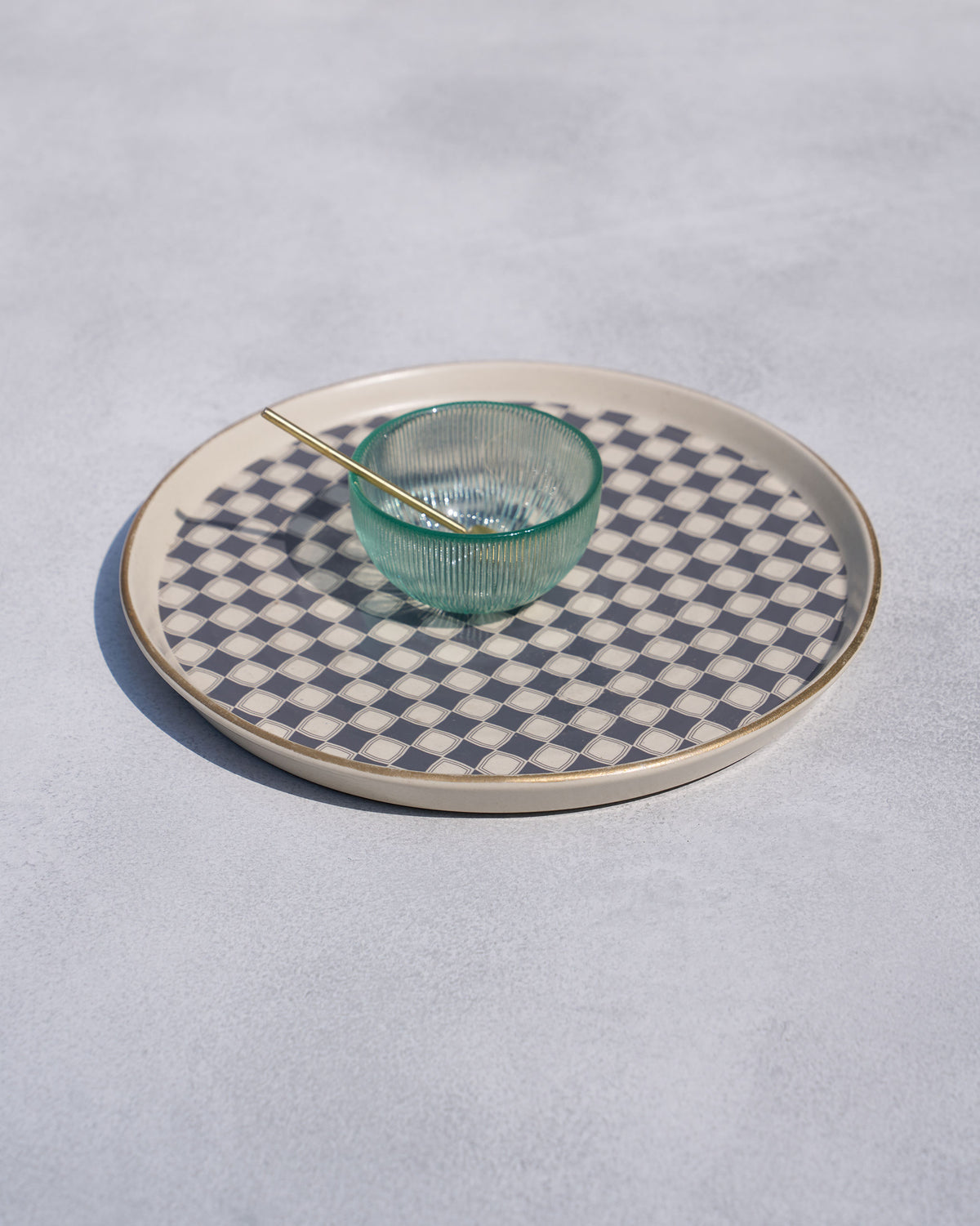 Fez chip and dip platter with grey checkered center and a green glass dip bowl.