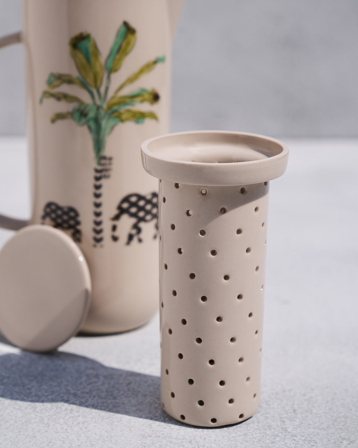 Close-up of the perforated ceramic infuser for the Ele carafe.