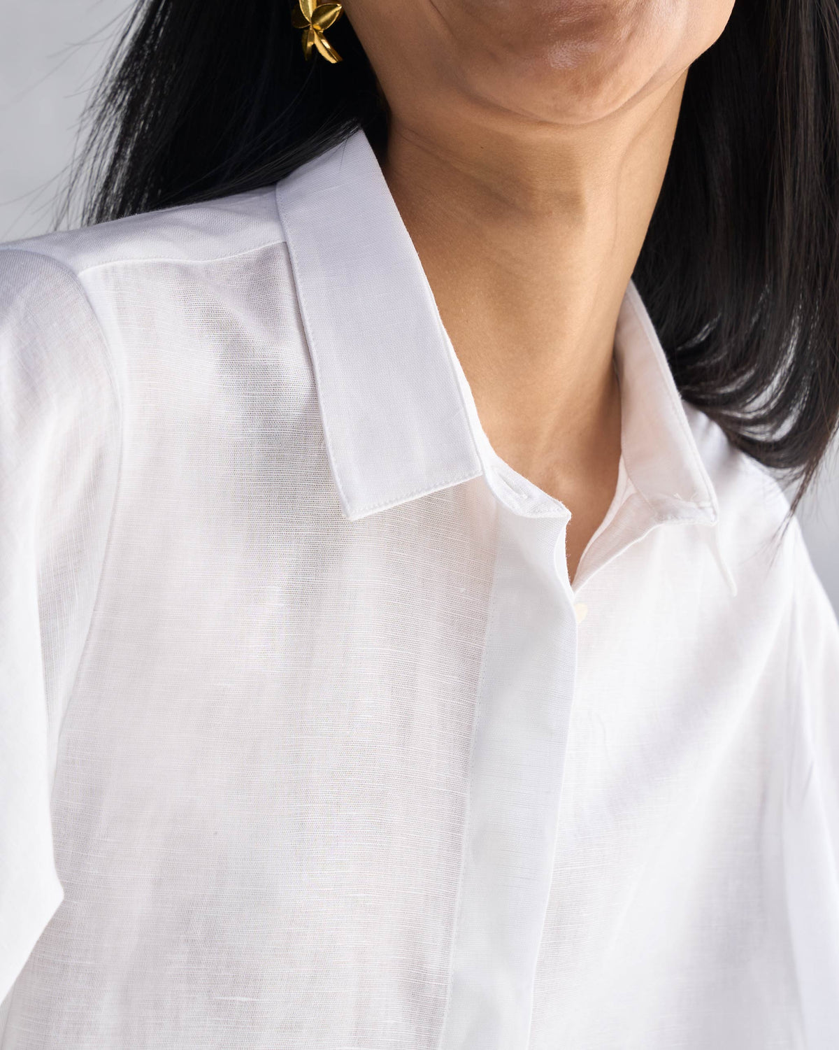 Close-up of a white Drop Armhole Shirt showing a pointed collar and linen weave.