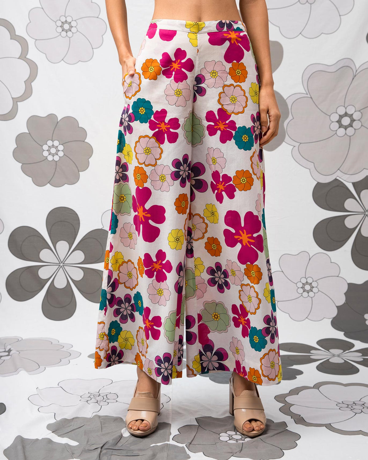 Person wearing multicolour Basic Pyjamas with a bright floral print.