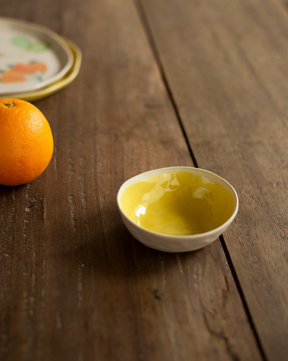 Mandovi Katori bowl with a yellow glaze inside.