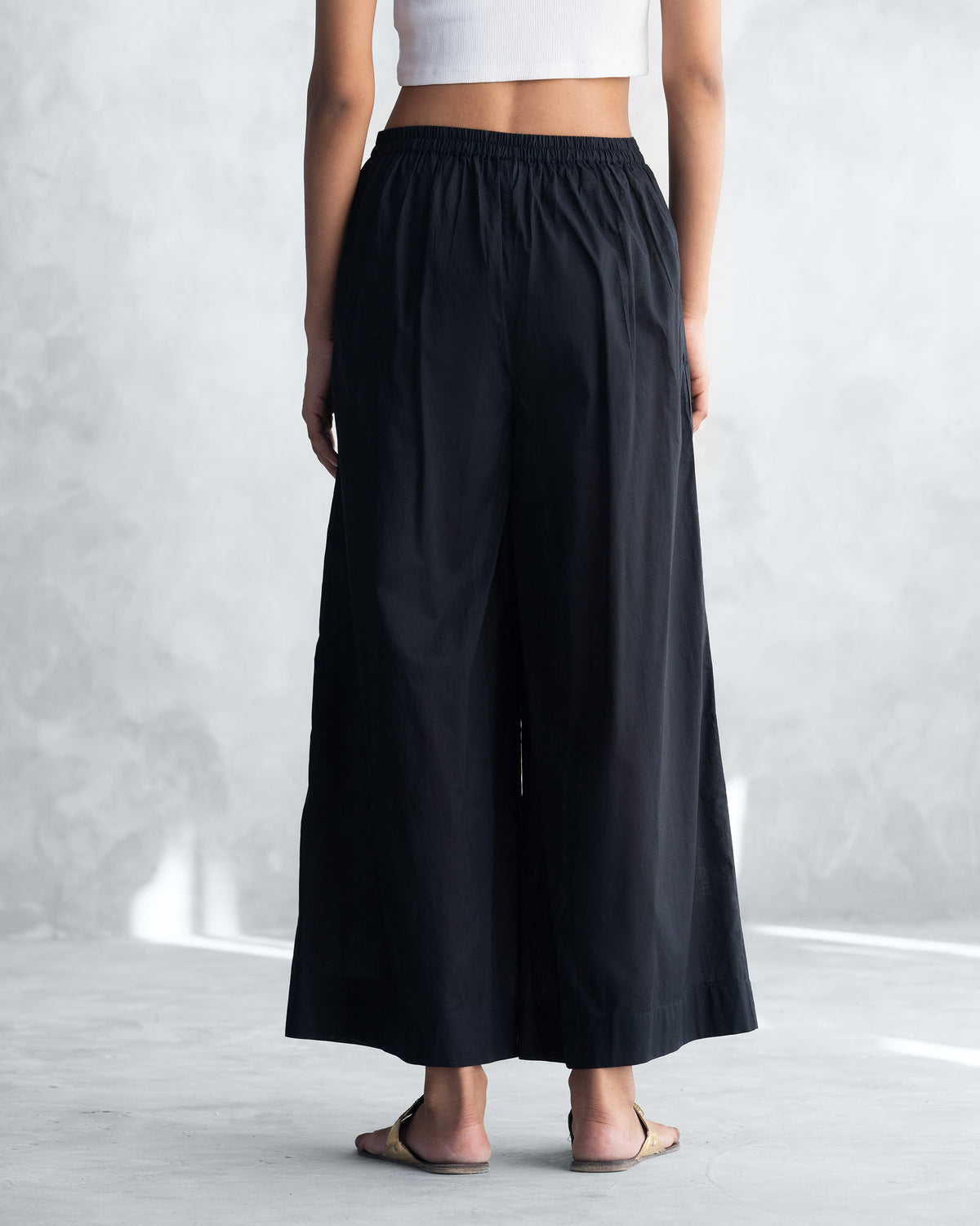 Back of black Basic Pyjamas with a gathered elastic waist.