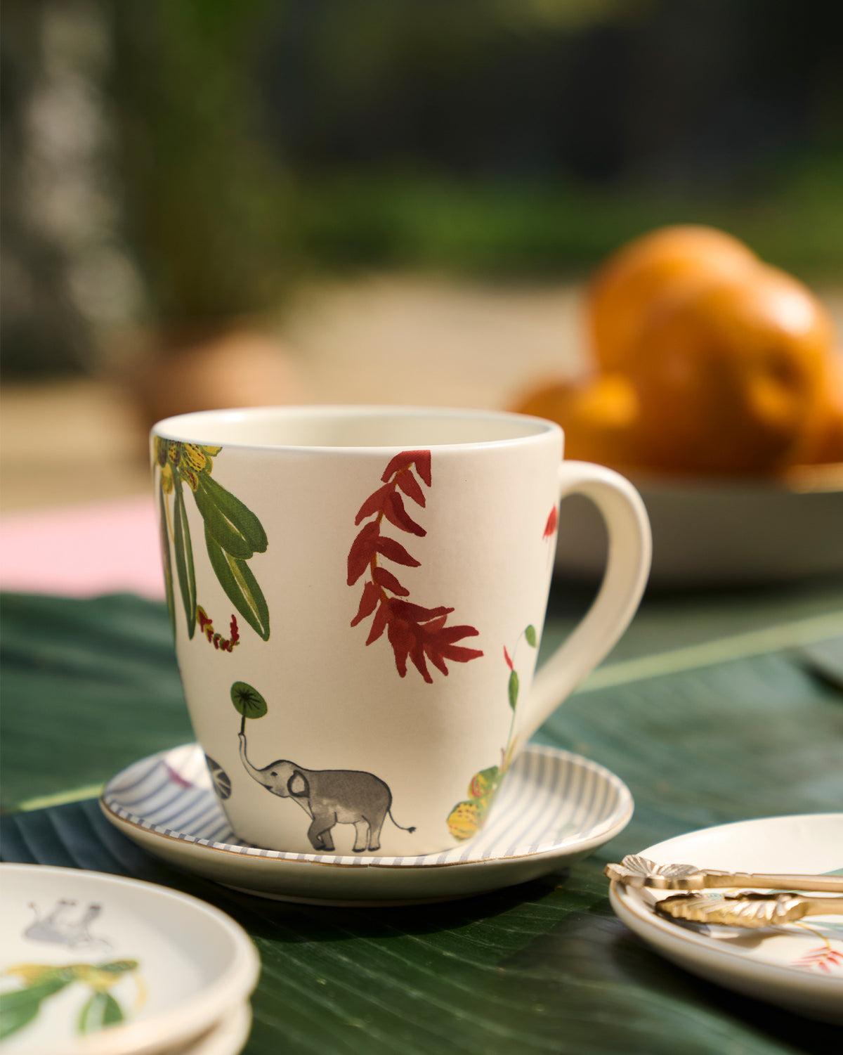 Thazin conical mug with an elephant printed on the side.