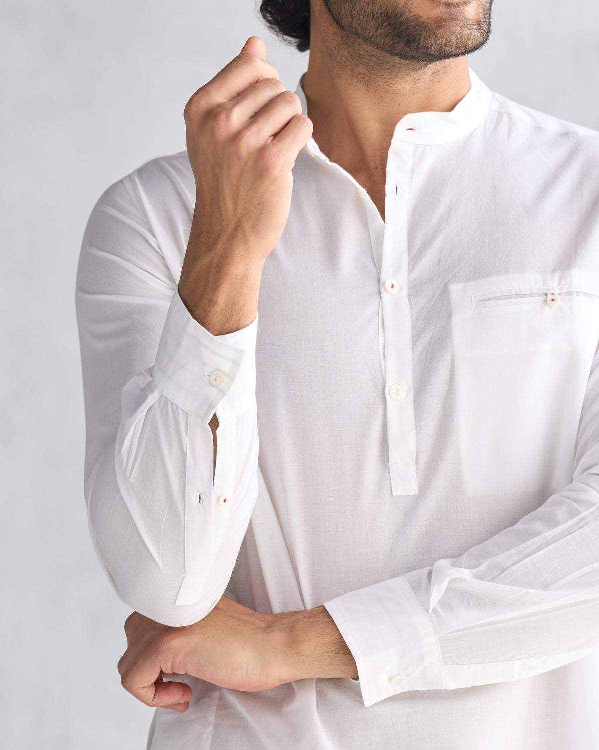 Close-up of a white Pondicherry Kurta showing the collar, placket, and chest pocket.
