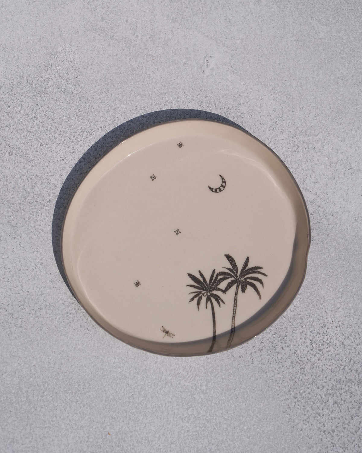 Swaying Palm Desert plate with palm trees, a crescent moon and stars.