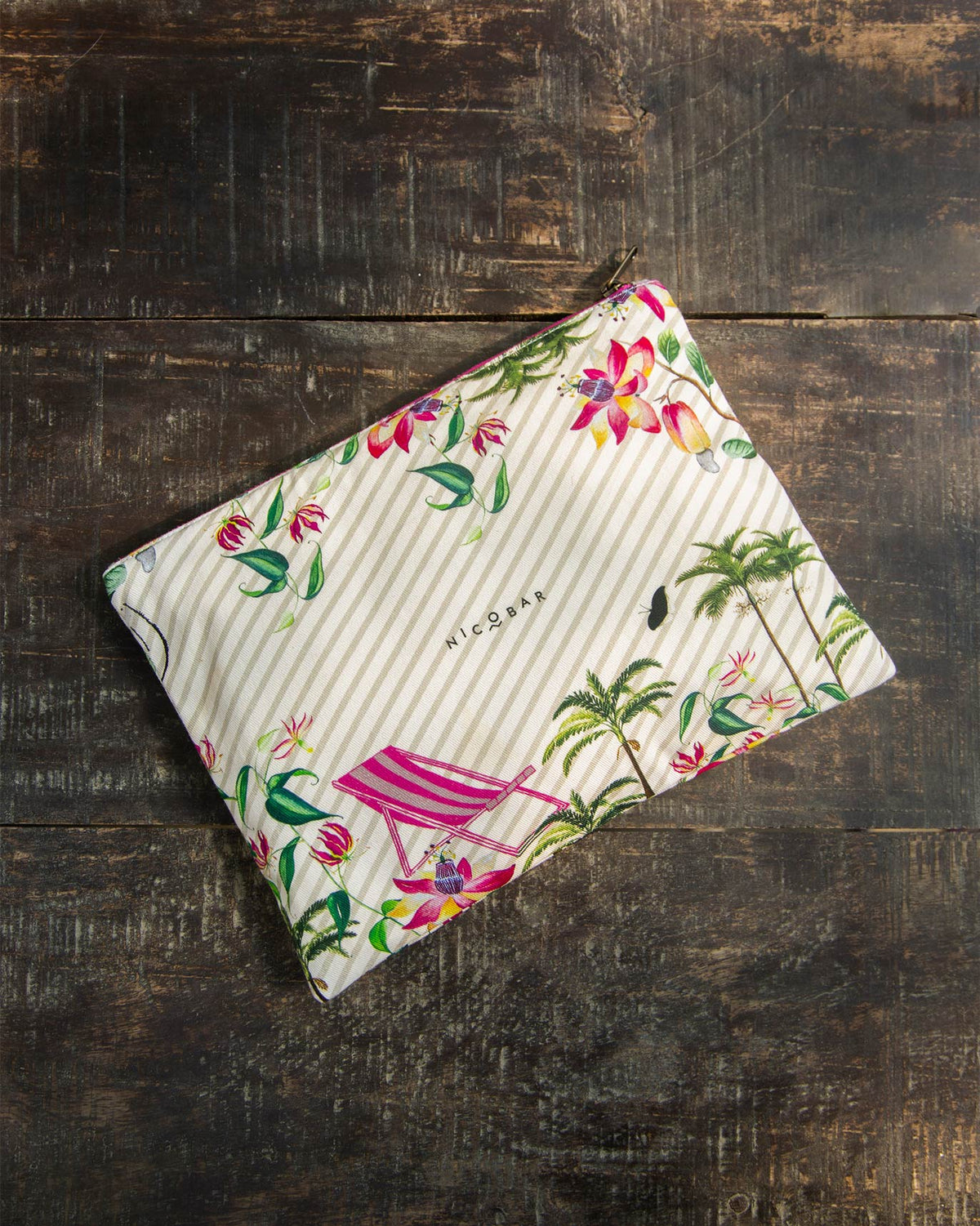 Botanics Jumbo Pouch laid flat, showing its floral and palm tree print.