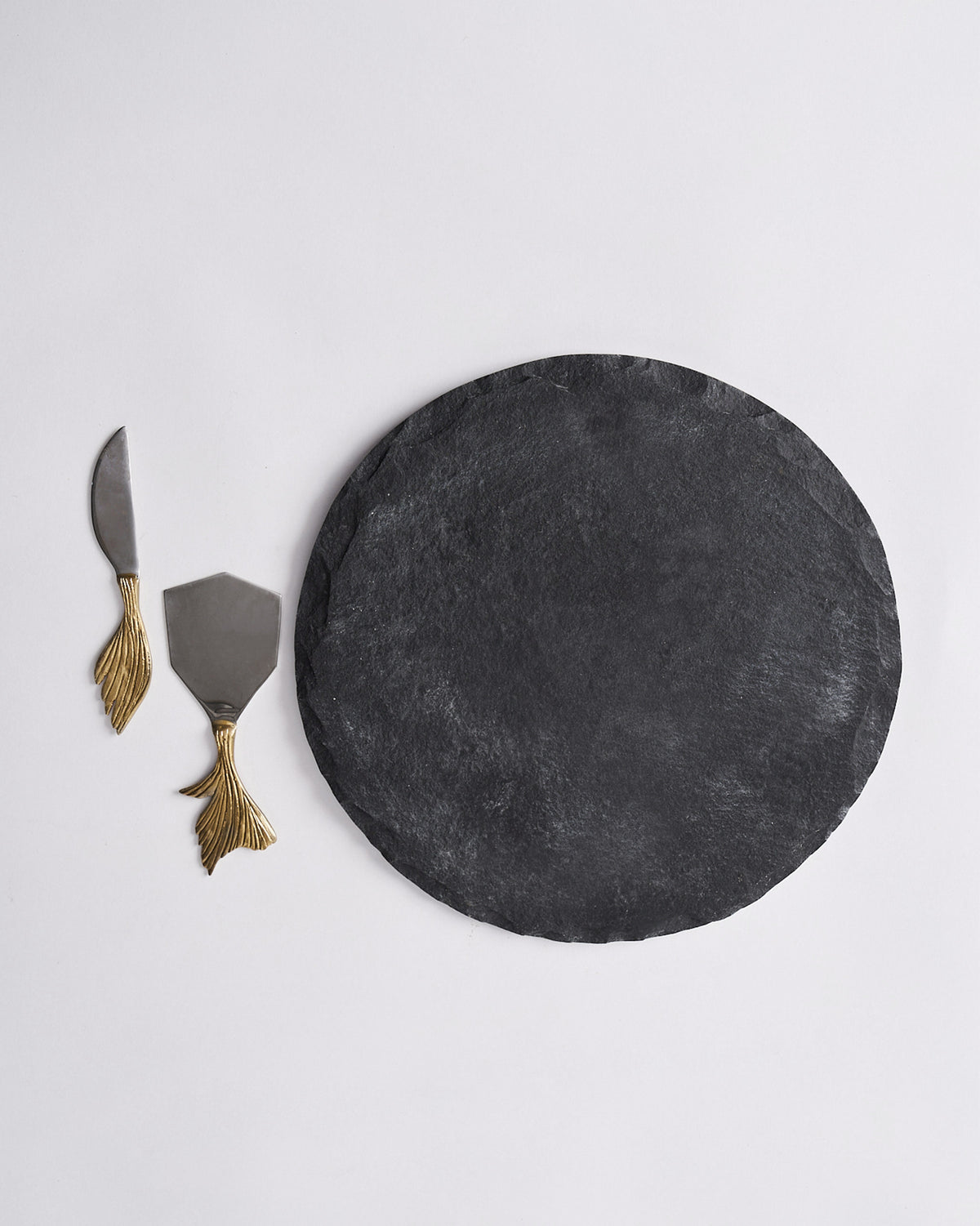 Overhead view of the Marina cheese platter set with both knives on the board.
