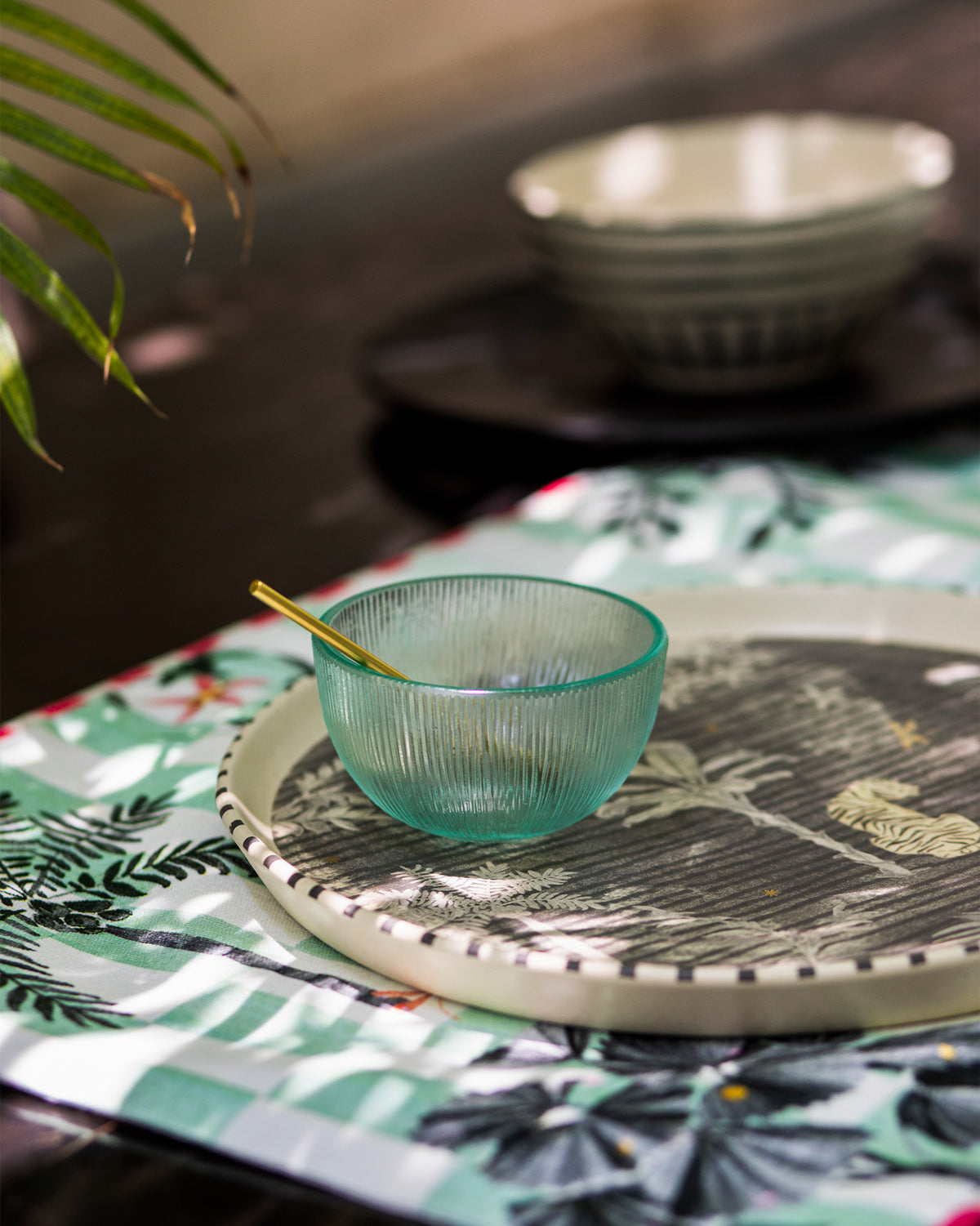 Periyar Chip & dip platter with a palm leaf motif, seen at an angle.