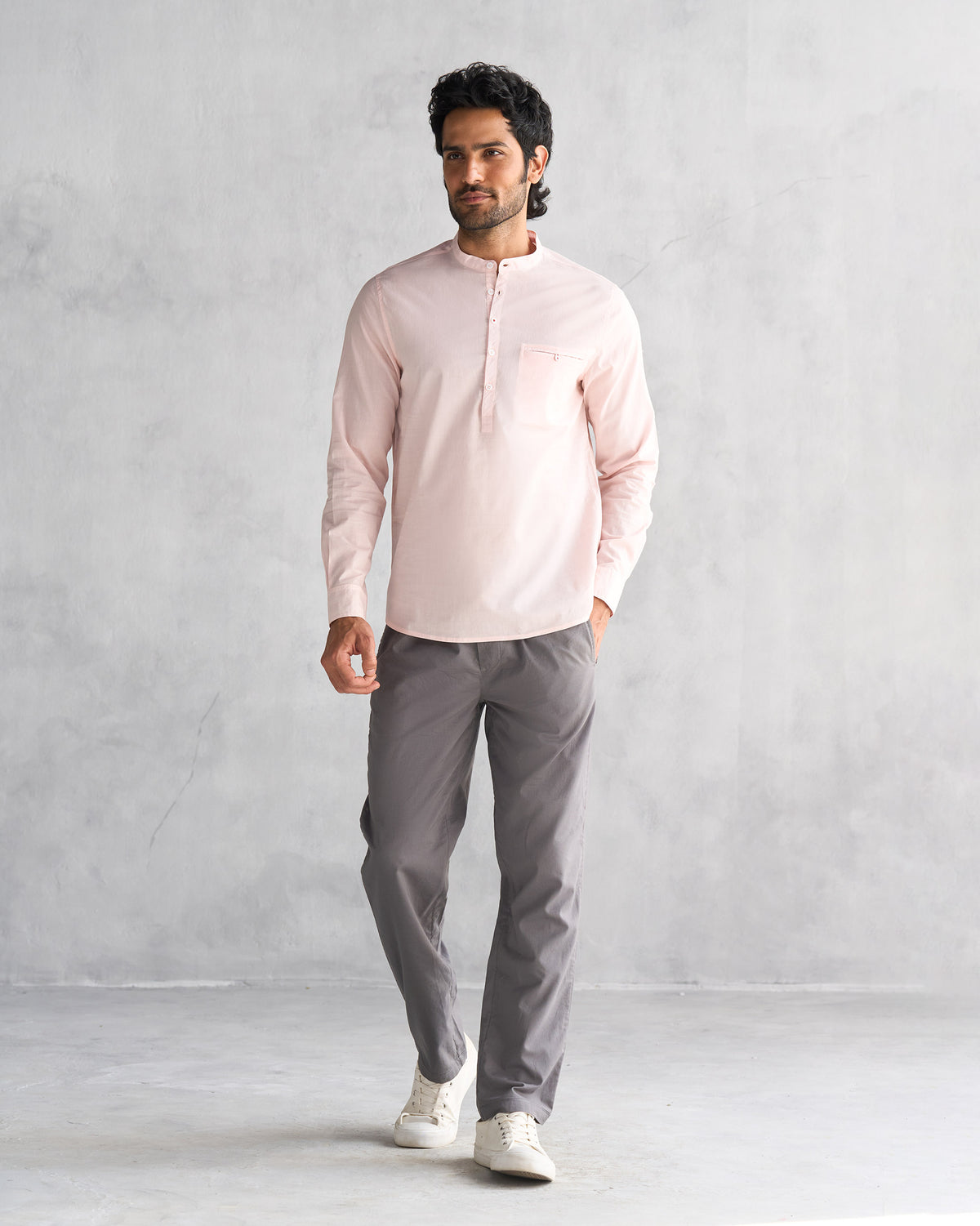 Full-length view of a pink Pondicherry shirt worn by a person.