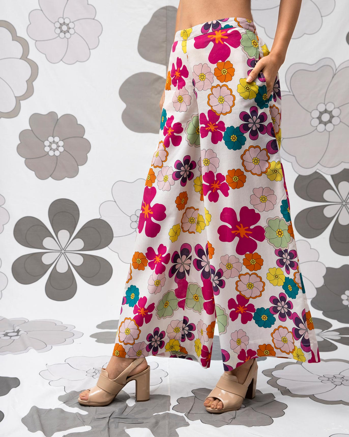 Person wearing multicolour Basic Pyjamas with a wide leg, turned to the side.