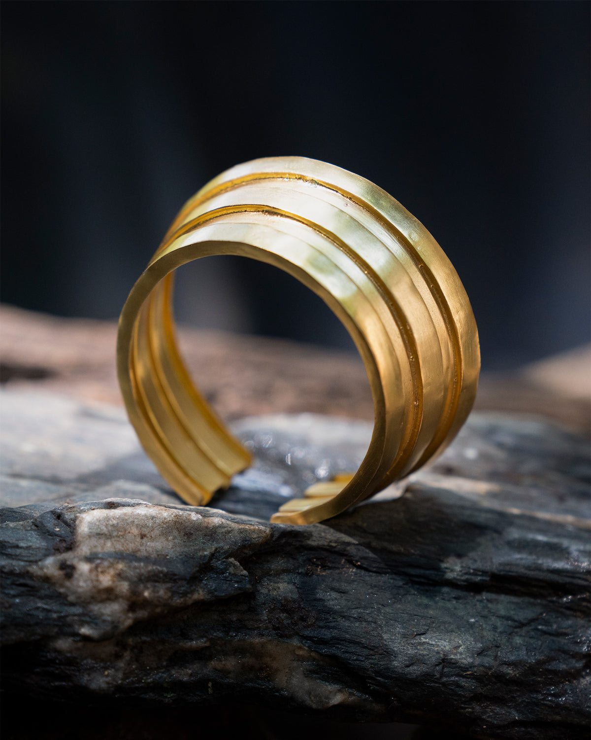 Gold Ridge open cuff bangle with three stacked bands.