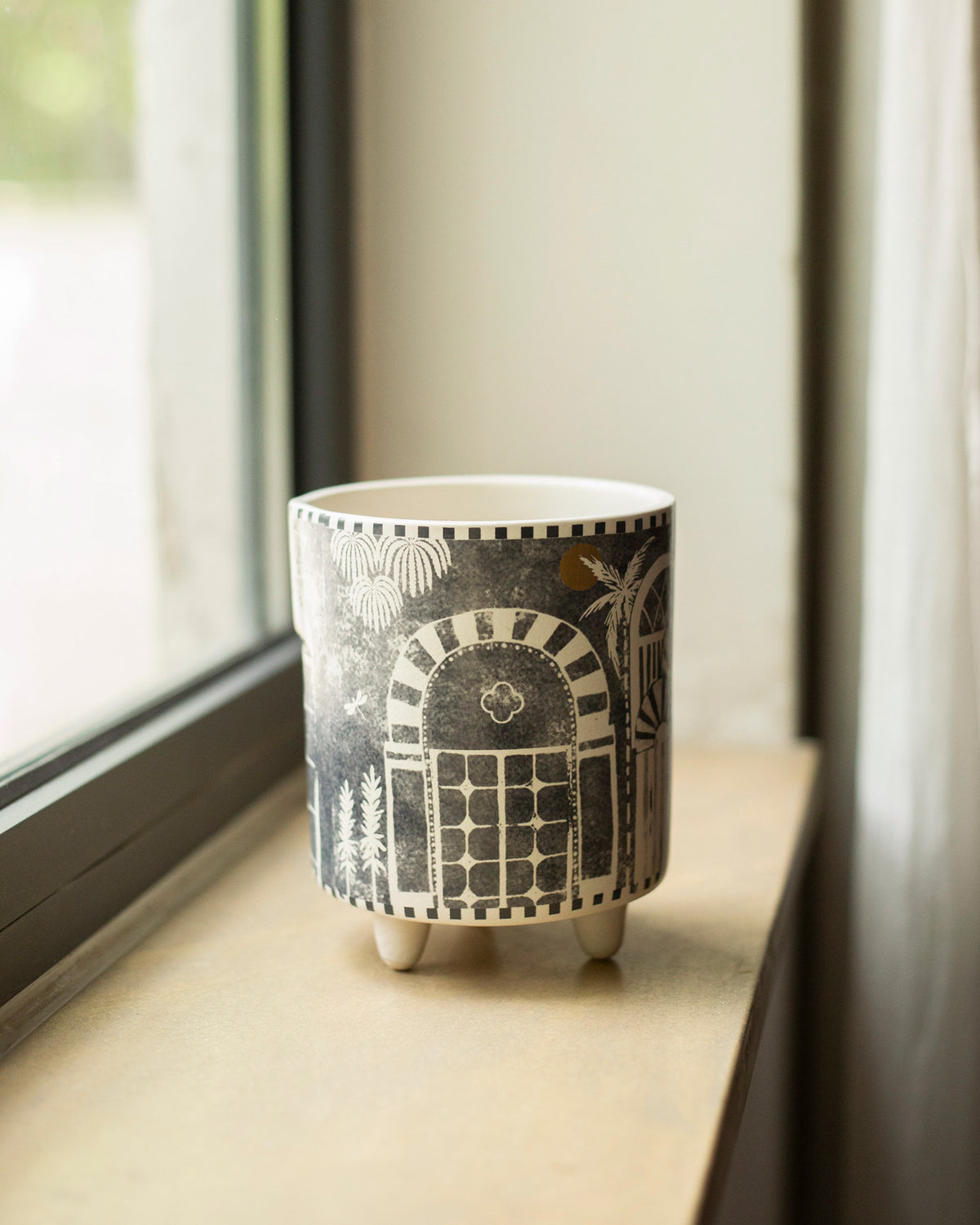 Side view of a Mario planter with an arched motif and short feet.