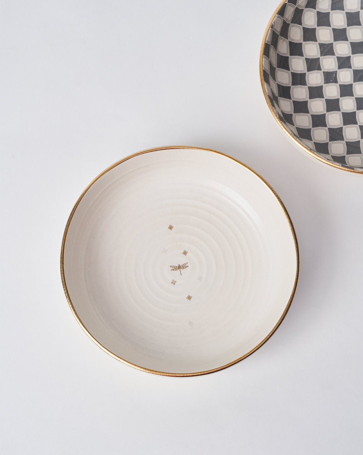 Cream Fez Shallow Bowl with a gold dragonfly motif and gold rim.