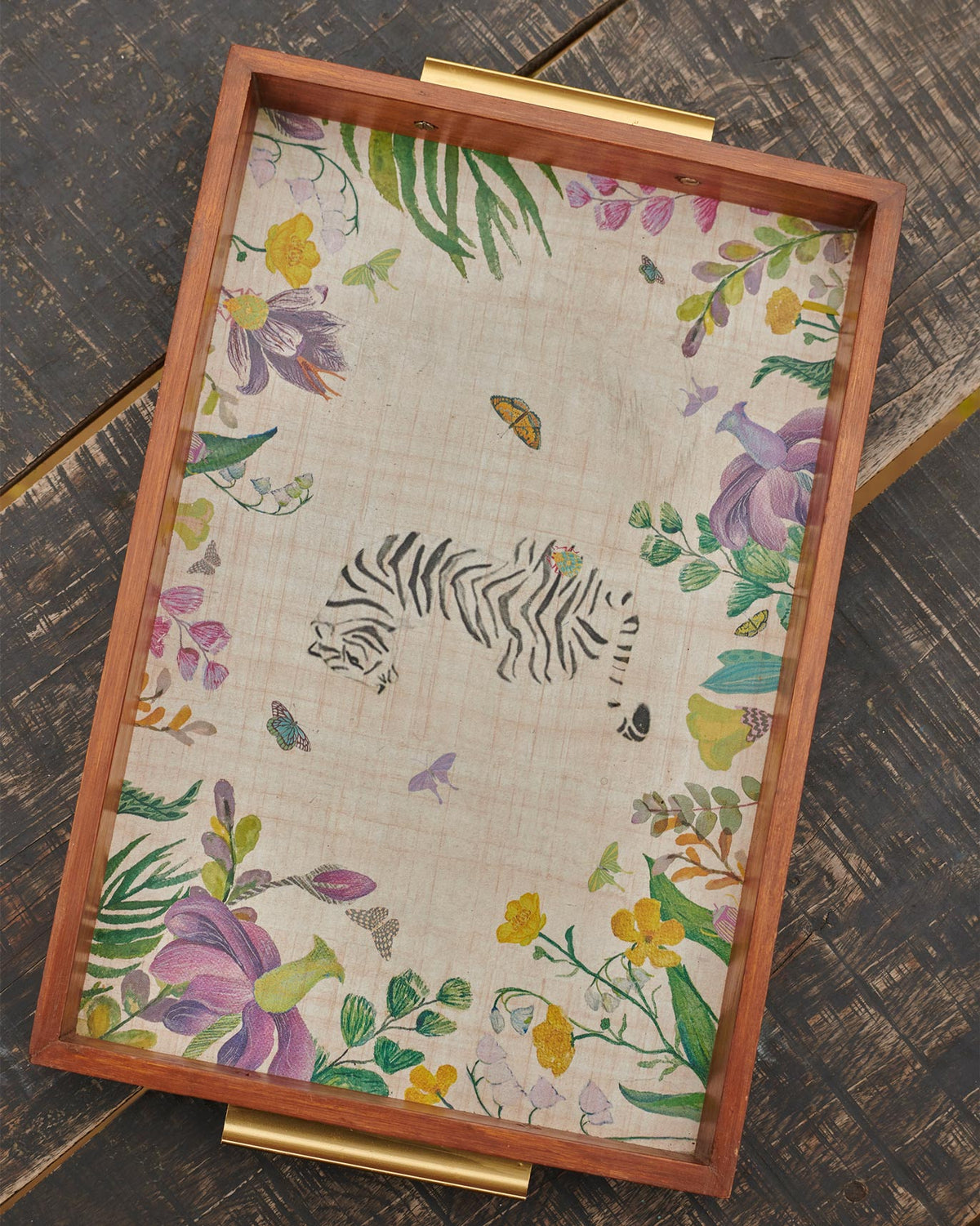 Close-up of a Waadi Rectangle Tray corner showing a brass handle and a tiger.