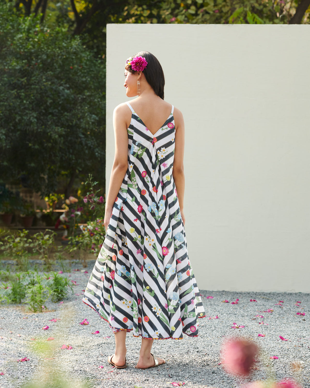 Back of a black and white striped floral dress with a deep V.