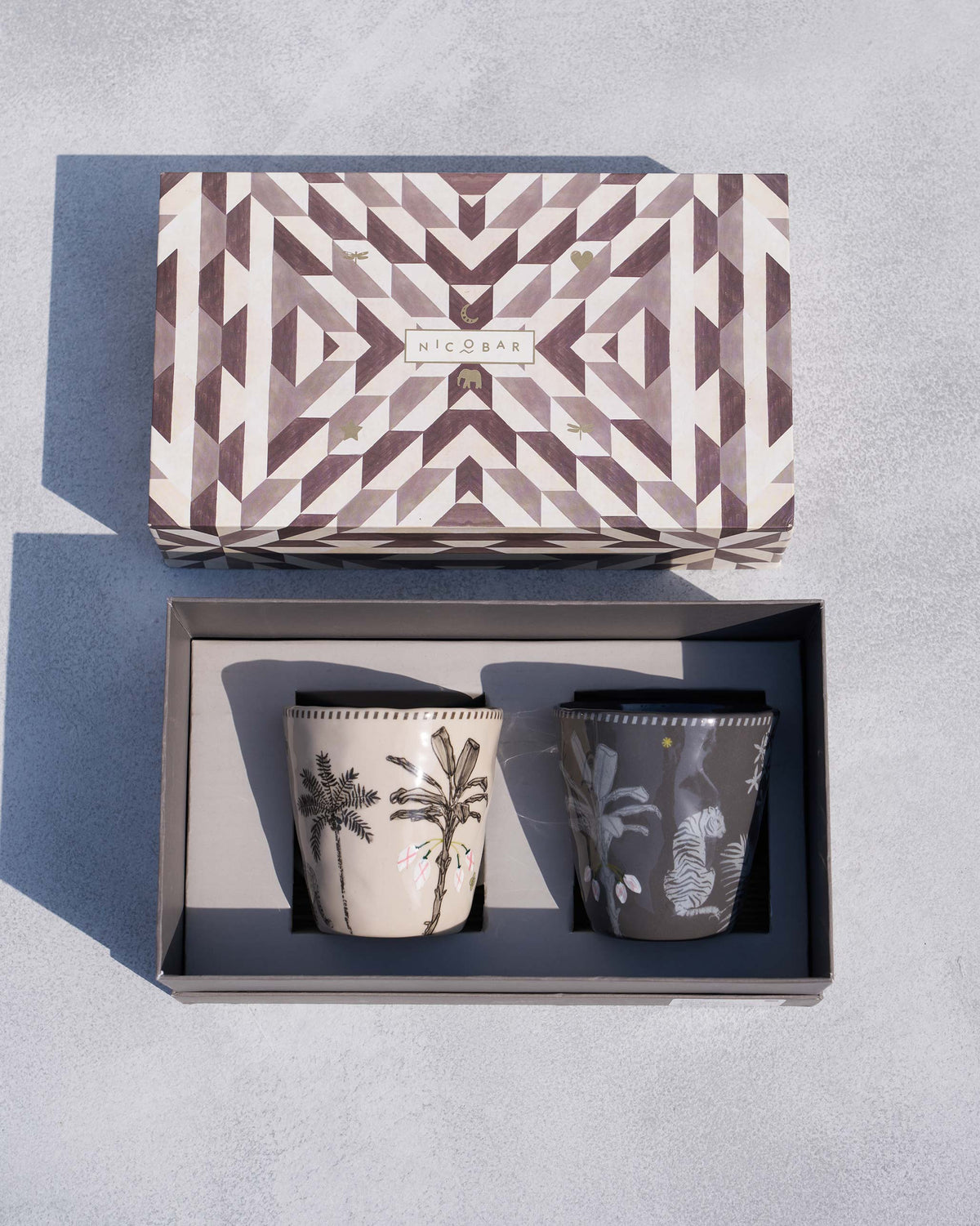 Pair of Malabar conical mugs in a Nicobar gift box with palm and tiger motifs.