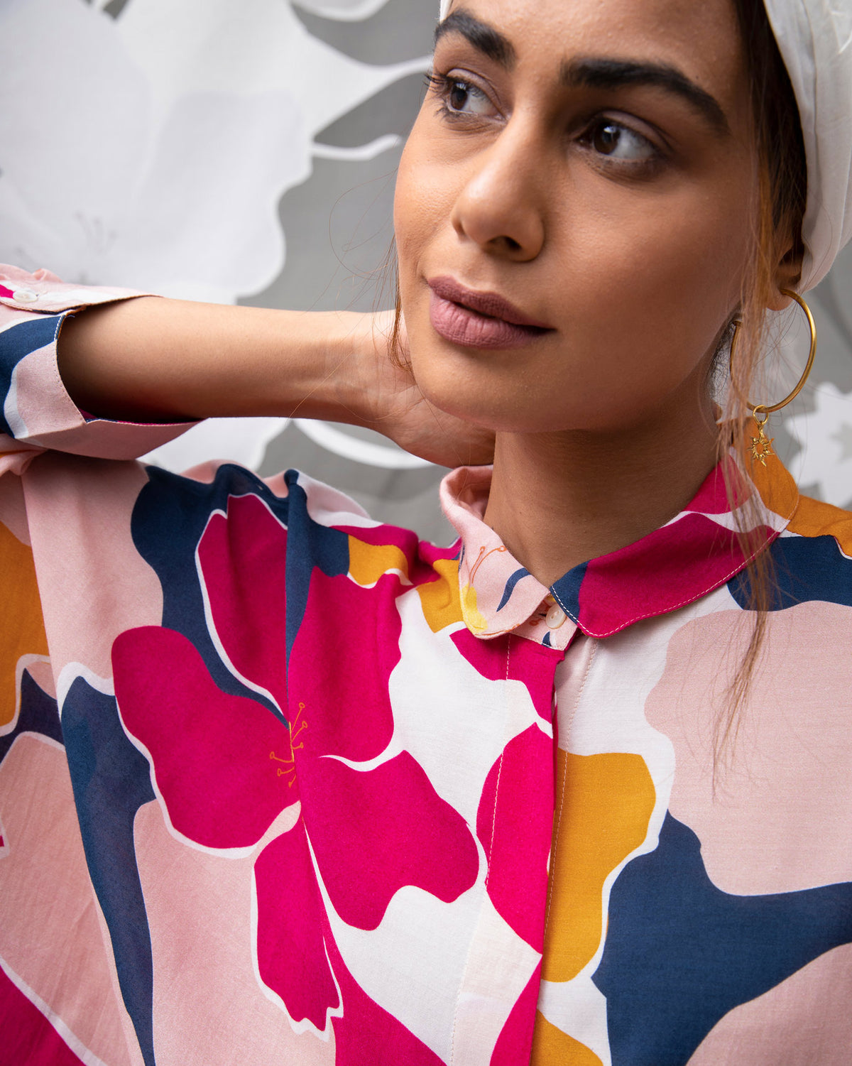 Close-up of the Boxy Shirt collar and placket in a pink and orange floral print.