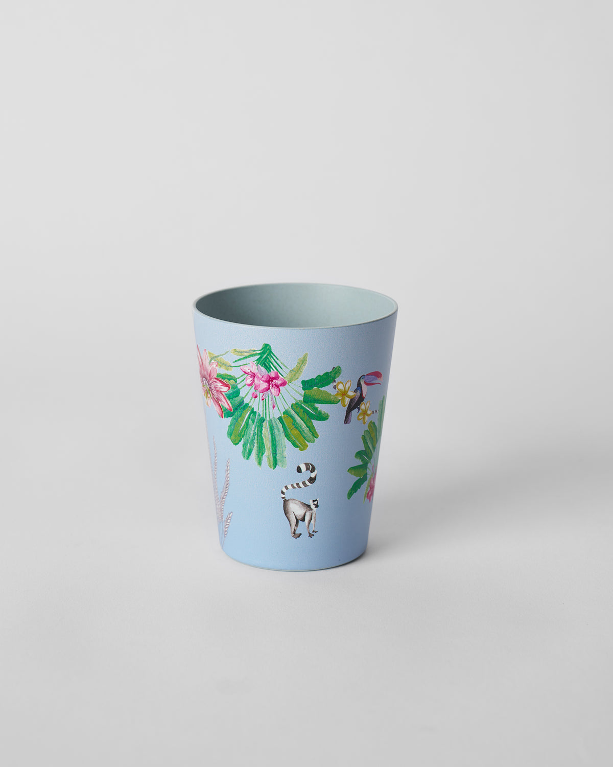 Dusty blue Toucan bamboo tumbler printed with a toucan, lemur and tropical flowers.