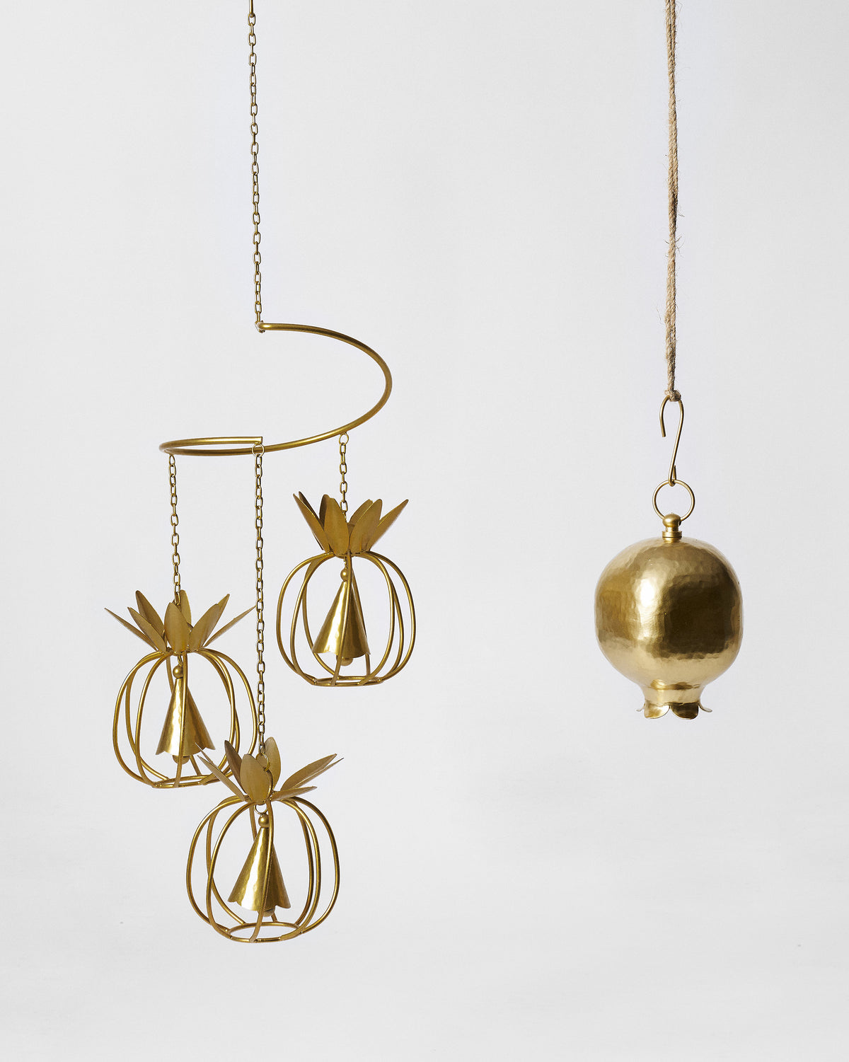 Orchard Sound Set with a gold pineapple wind chime and a hammered Anar pomegranate bell.