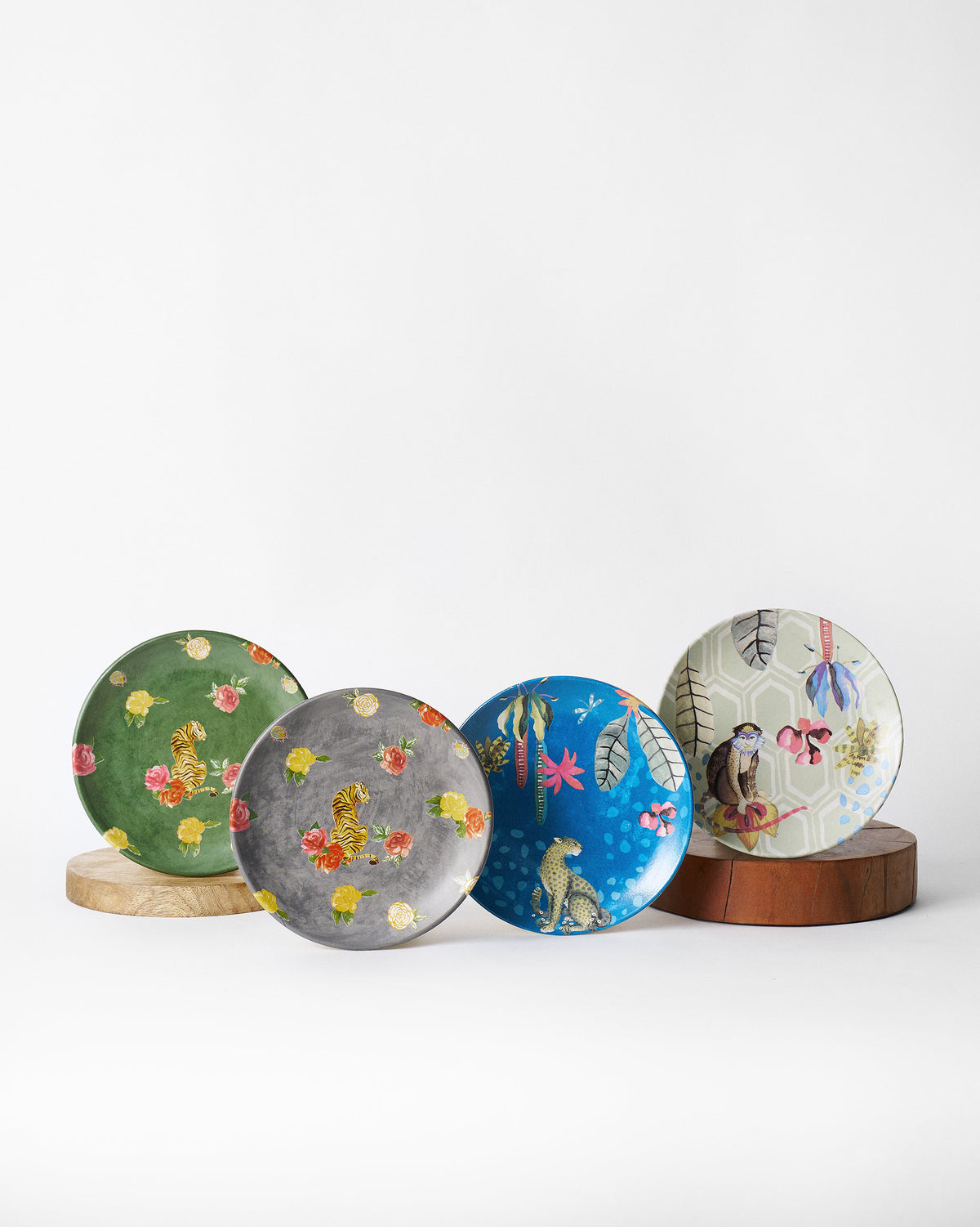 Wild Terrain Set of four plates with tiger, cheetah and monkey designs.