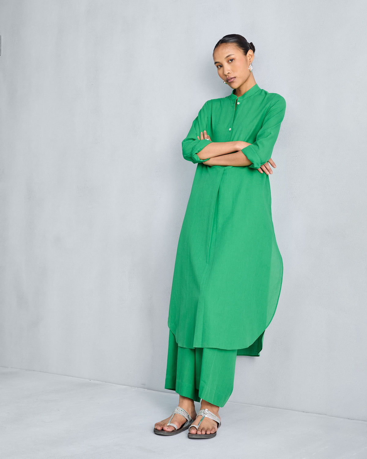 Bright green wide-leg pyjamas worn with a matching green mandarin collar kurta.