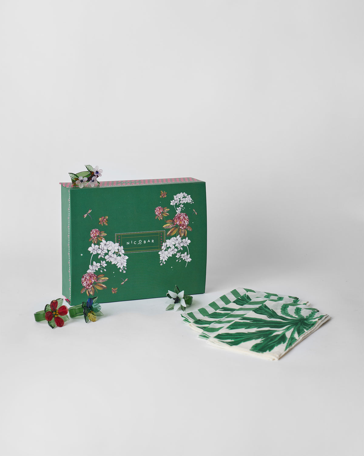 Vanika Gift Set with its green box, napkins and flower napkin rings.