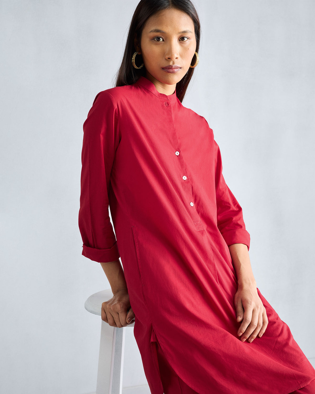 Person wearing a red matching kurta styled with Basic pyjamas.