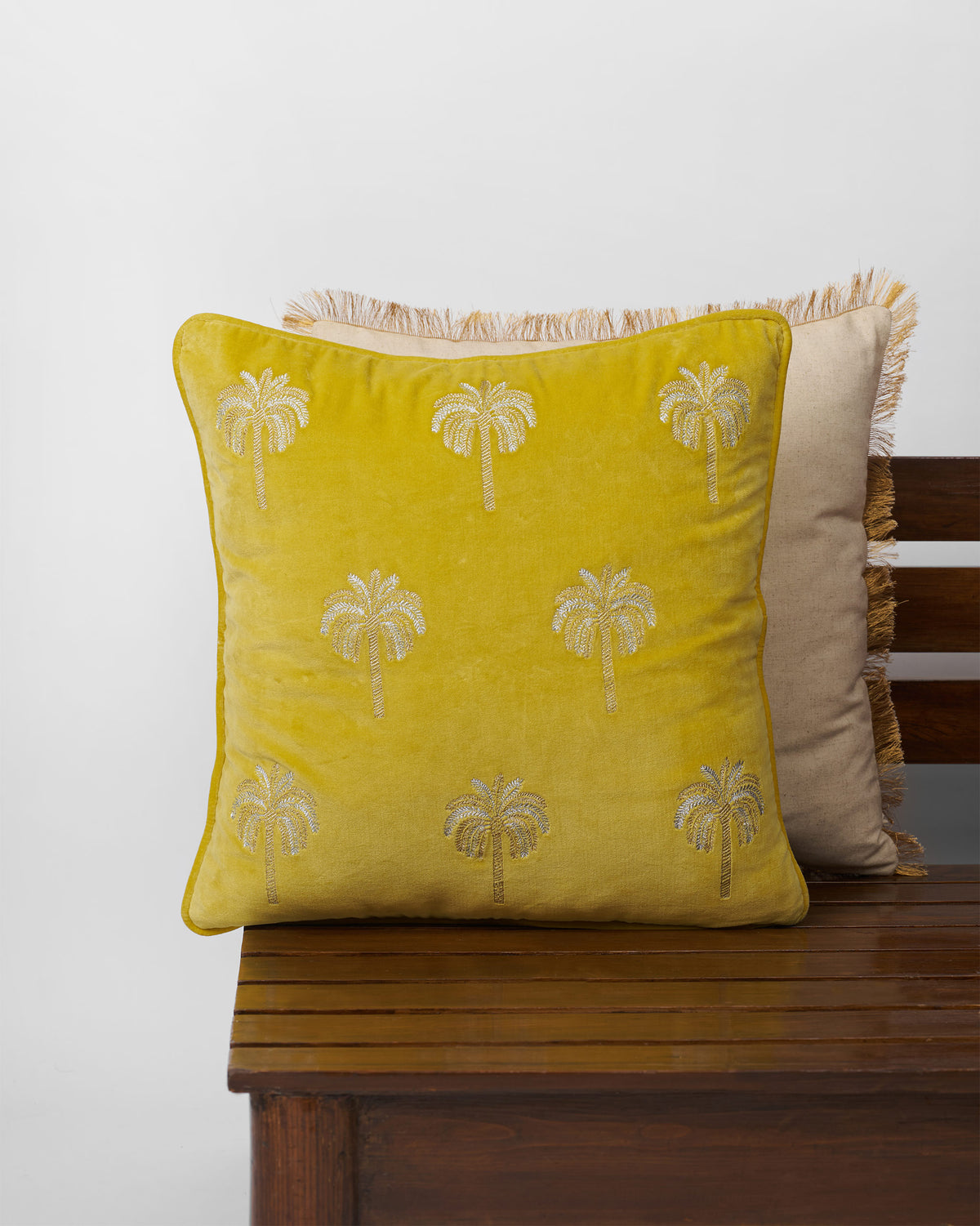 Yellow Palm Shimmer cushion cover with embroidered palm trees.