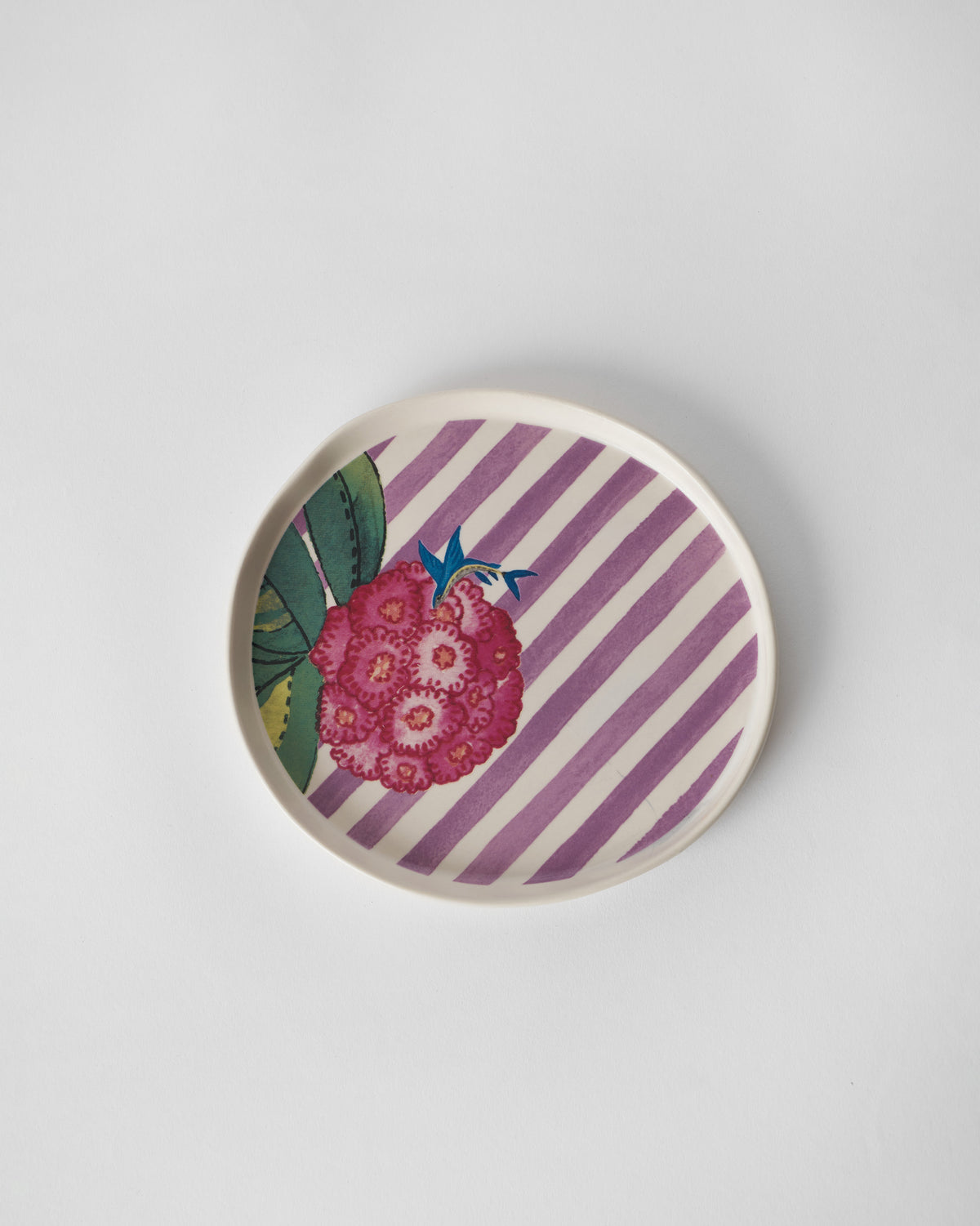 Buransh dessert plate with pink rhododendron blooms on lavender stripes.