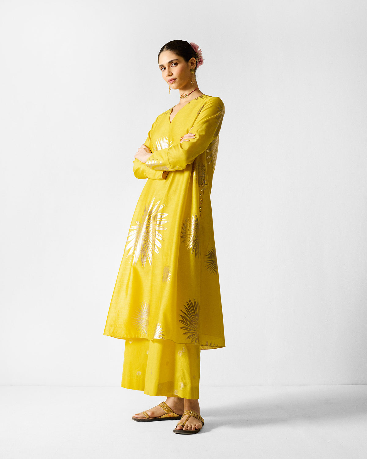 Side view of the Basic Pyjamas in chartreuse with a fan-shaped gold print.