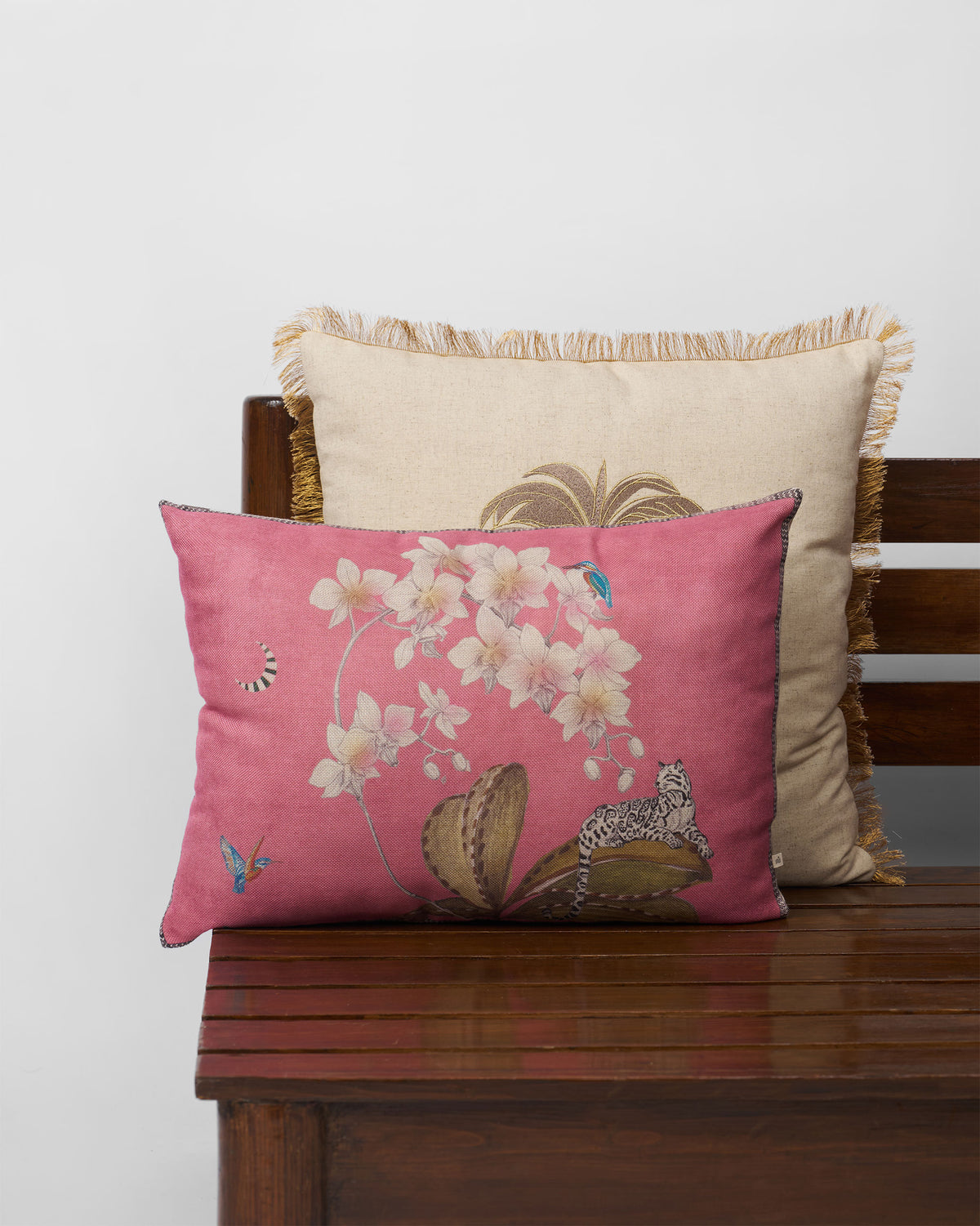 Reesha Cushion Cover in pink with orchid and leopard motifs.