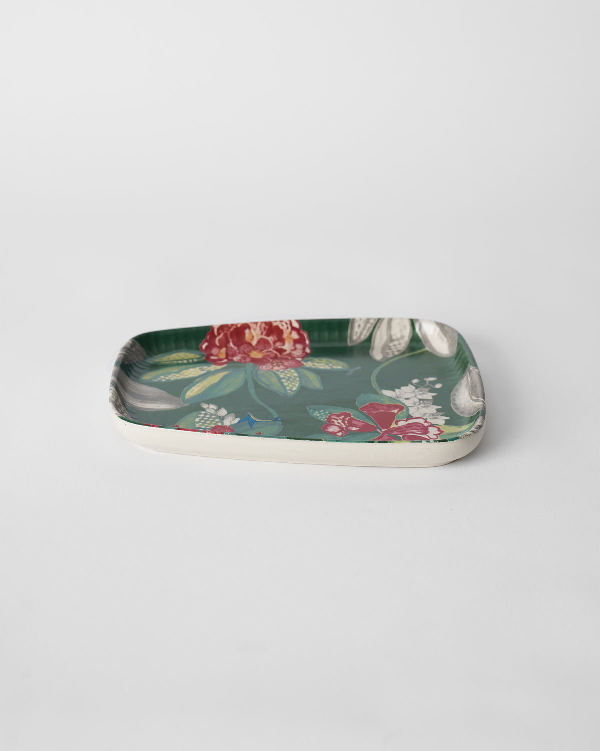 Buransh stoneware platter with pink rhododendron blooms on a deep green ground.