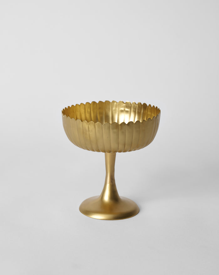 Matte gold Dhaara serving bowl with a scalloped fluted rim on a pedestal.