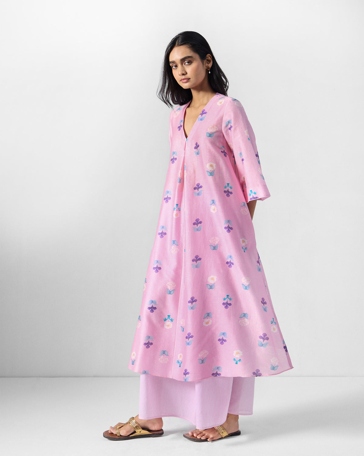 Side view of a pink floral Hera Kurta Set showing the A-line flare.