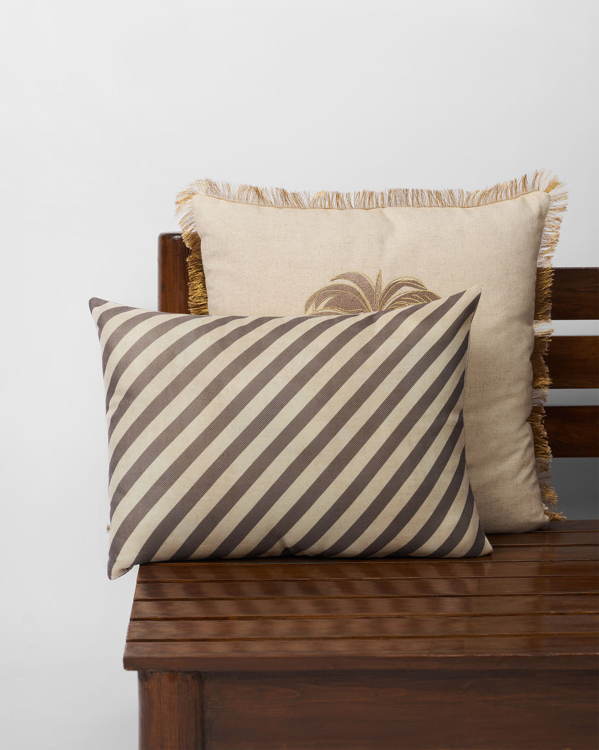 Reesha Cushion Cover with a diagonal stripe pattern.