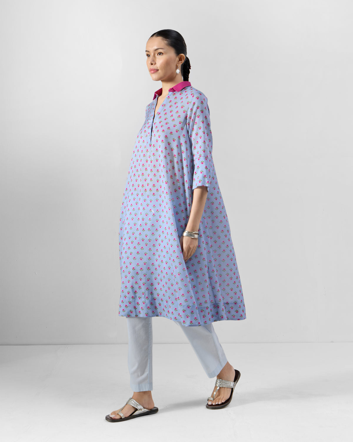Ice blue Kovvur Kurta Set with pink floral print and a flared hem.