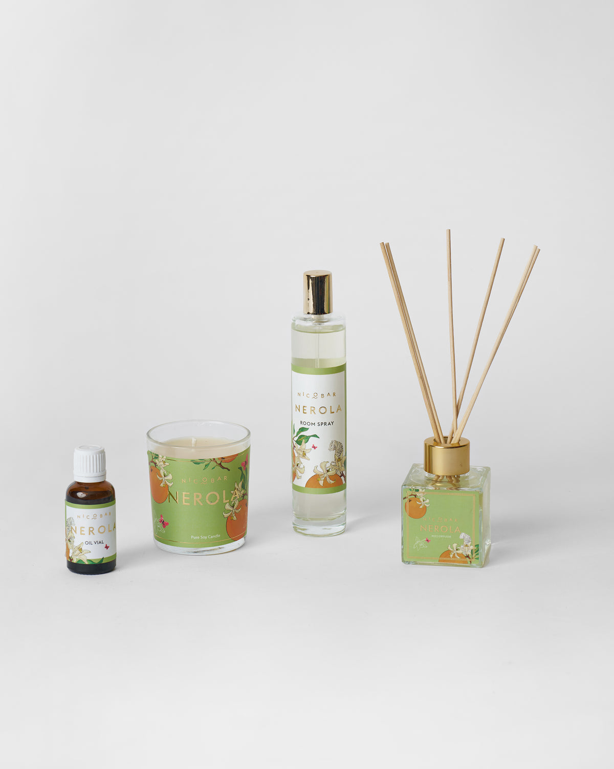 Nerola oil vial, candle, room spray, and reed diffuser lined up together.