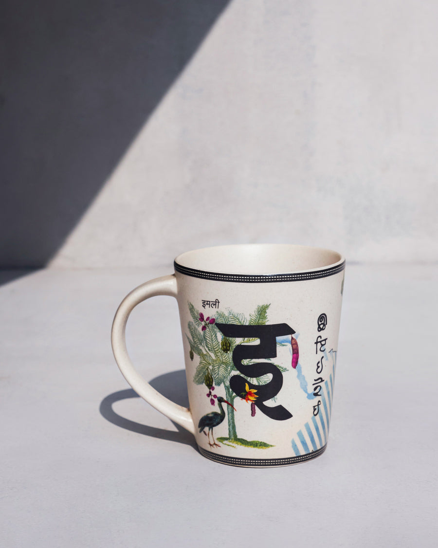 The Imli Mug side-on, with a tamarind tree.