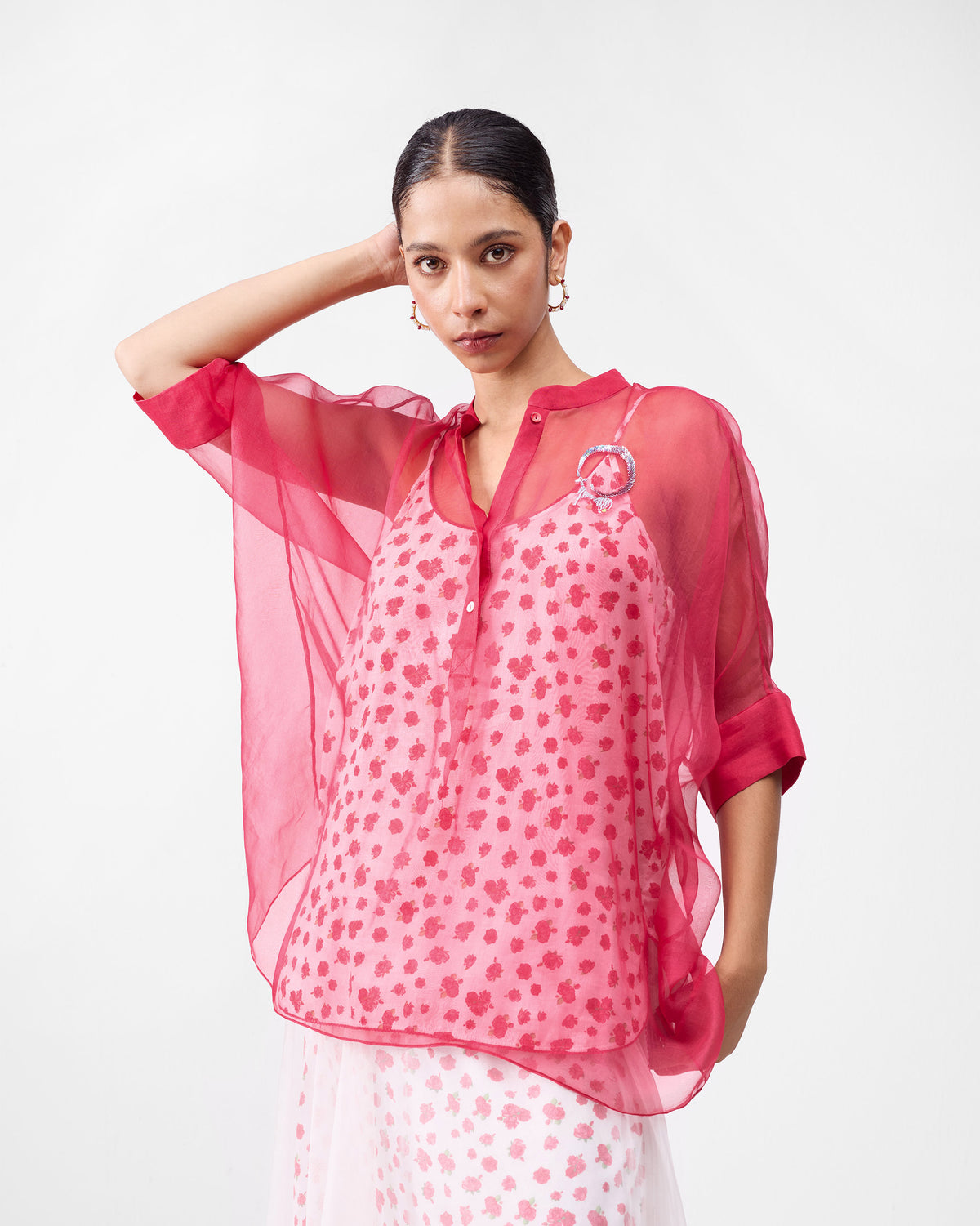 Sheer watermelon shirt layered over an ivory floral camisole from the Desert Bloom set.