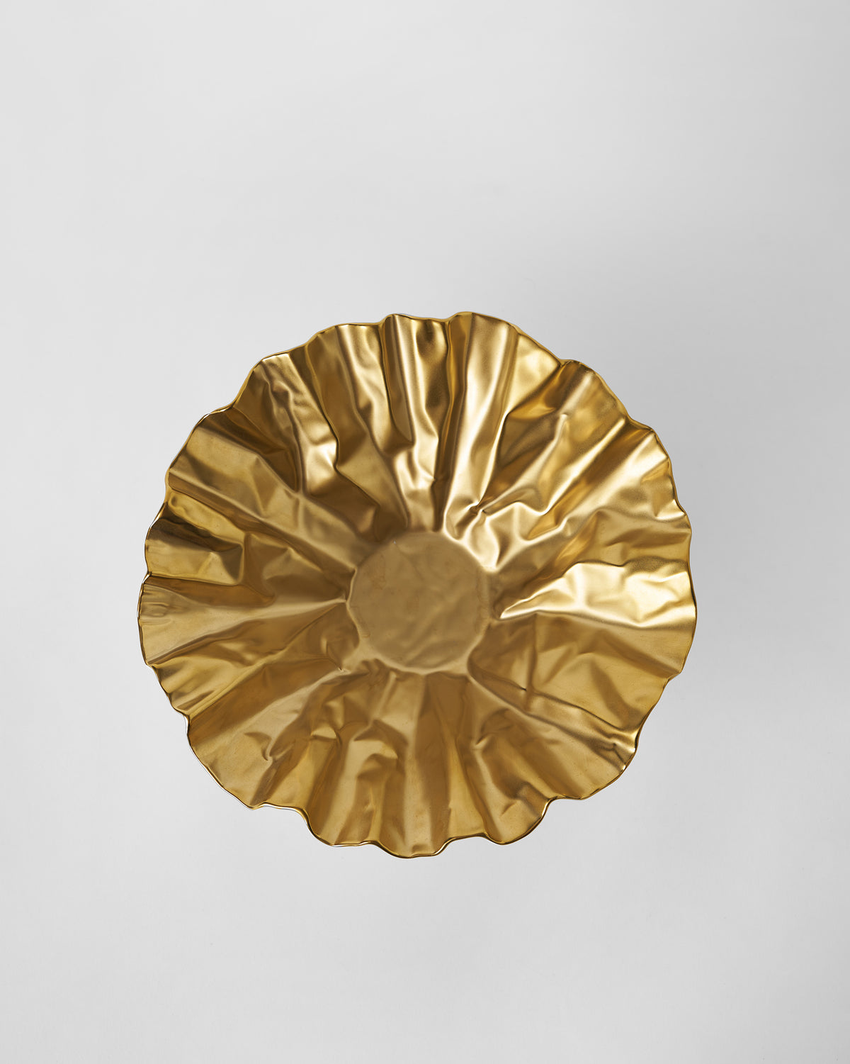 Dhaara Fruit Bowl seen from above, showing its ruffled gold interior.