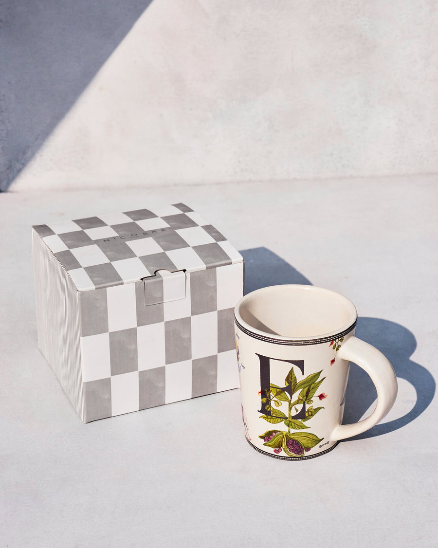 The Elaichi Mug beside its chequered Nicobar gift box.