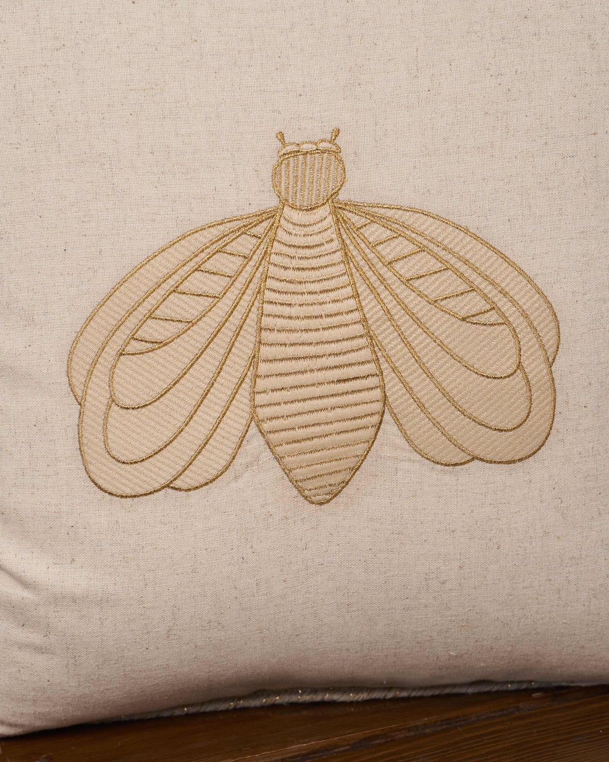 Close-up of the Bumble Bee Cushion Cover showing its embroidered bee.
