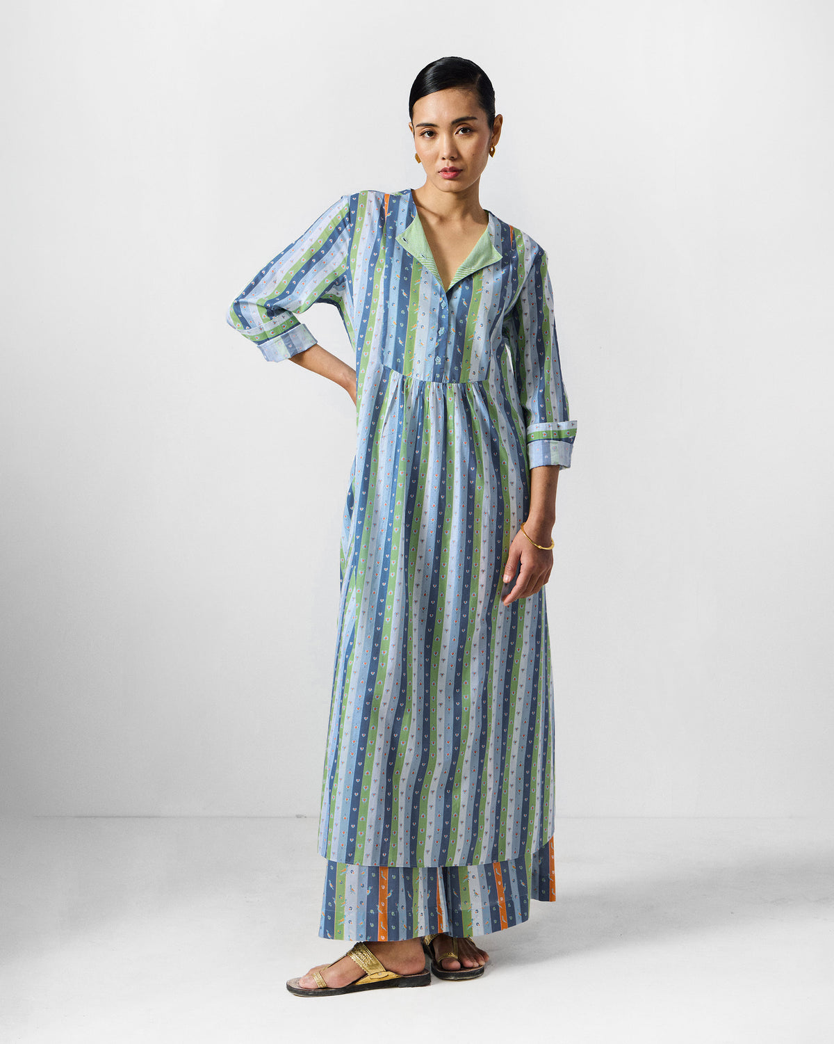 Person wearing the Imke kurta set with a band collar and button placket.