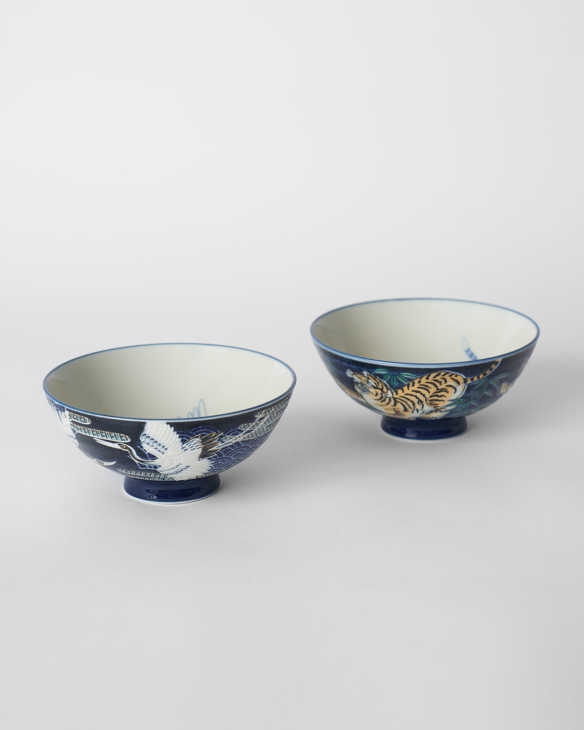 Blue Crane and Tiger Bowls showing a flying crane and a prowling tiger.