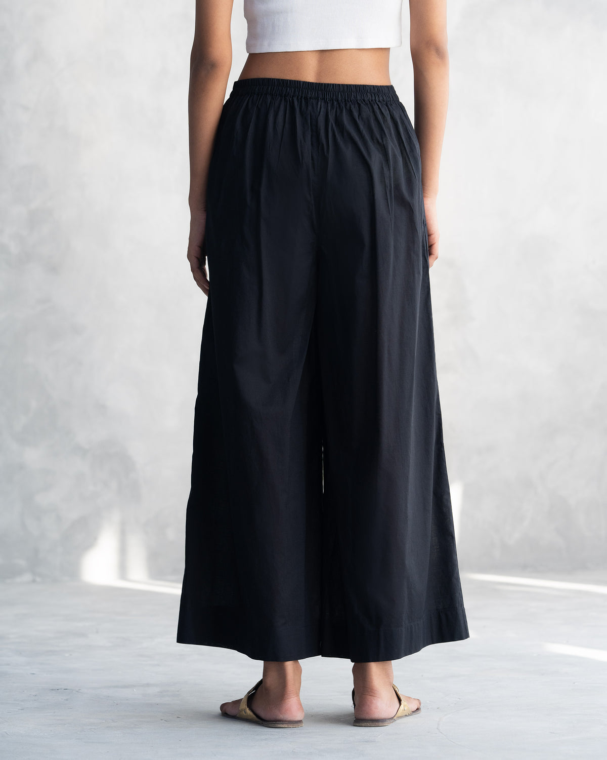 Back of the black wide-leg pants from the Eclipse set.