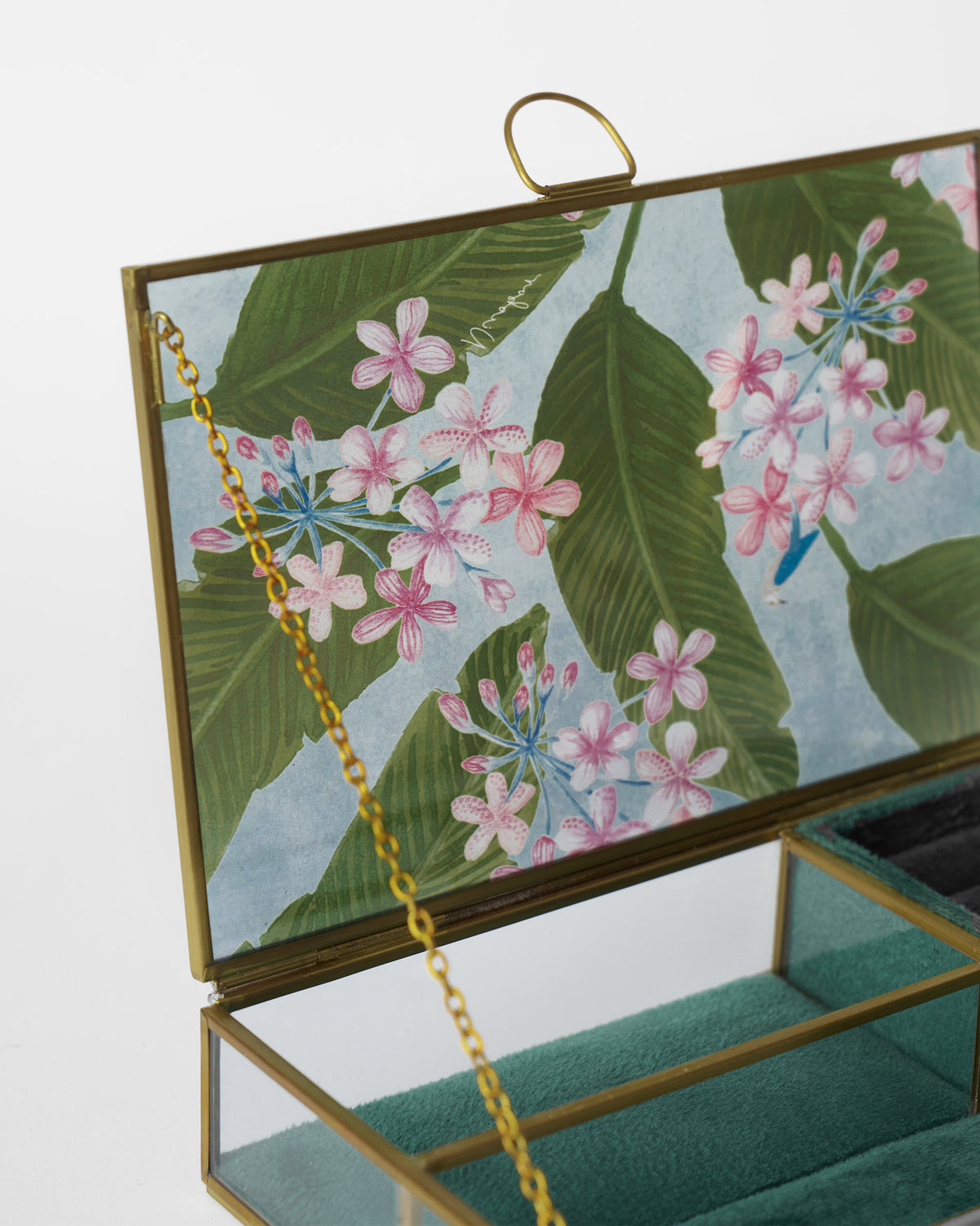 Close-up of the open Madhumalti Jewellery Box showing its gold chain and teal velvet.